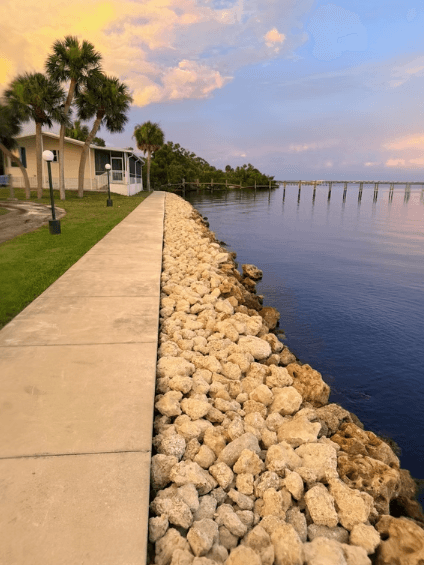 Salt and pepper stone aggregate installation completed landscaping project Florida