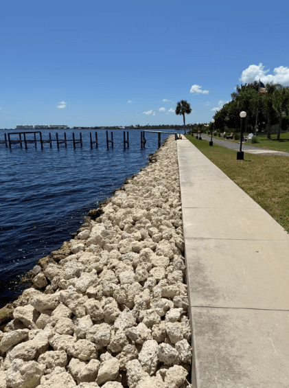 Cezars LLC team delivering and installing aggregate materials on a Southwest Florida construction site