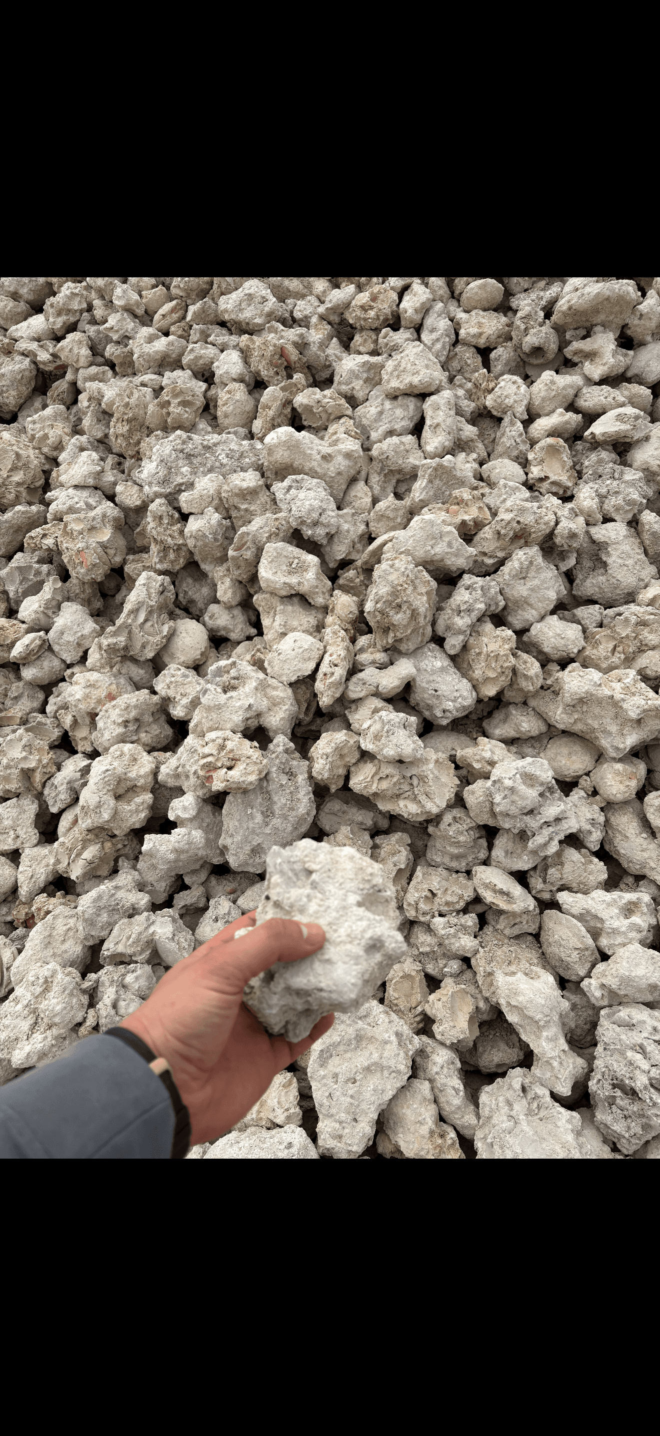 Small 3 to 6 inch limestone rip rap rock for shoreline erosion control Southwest Florida